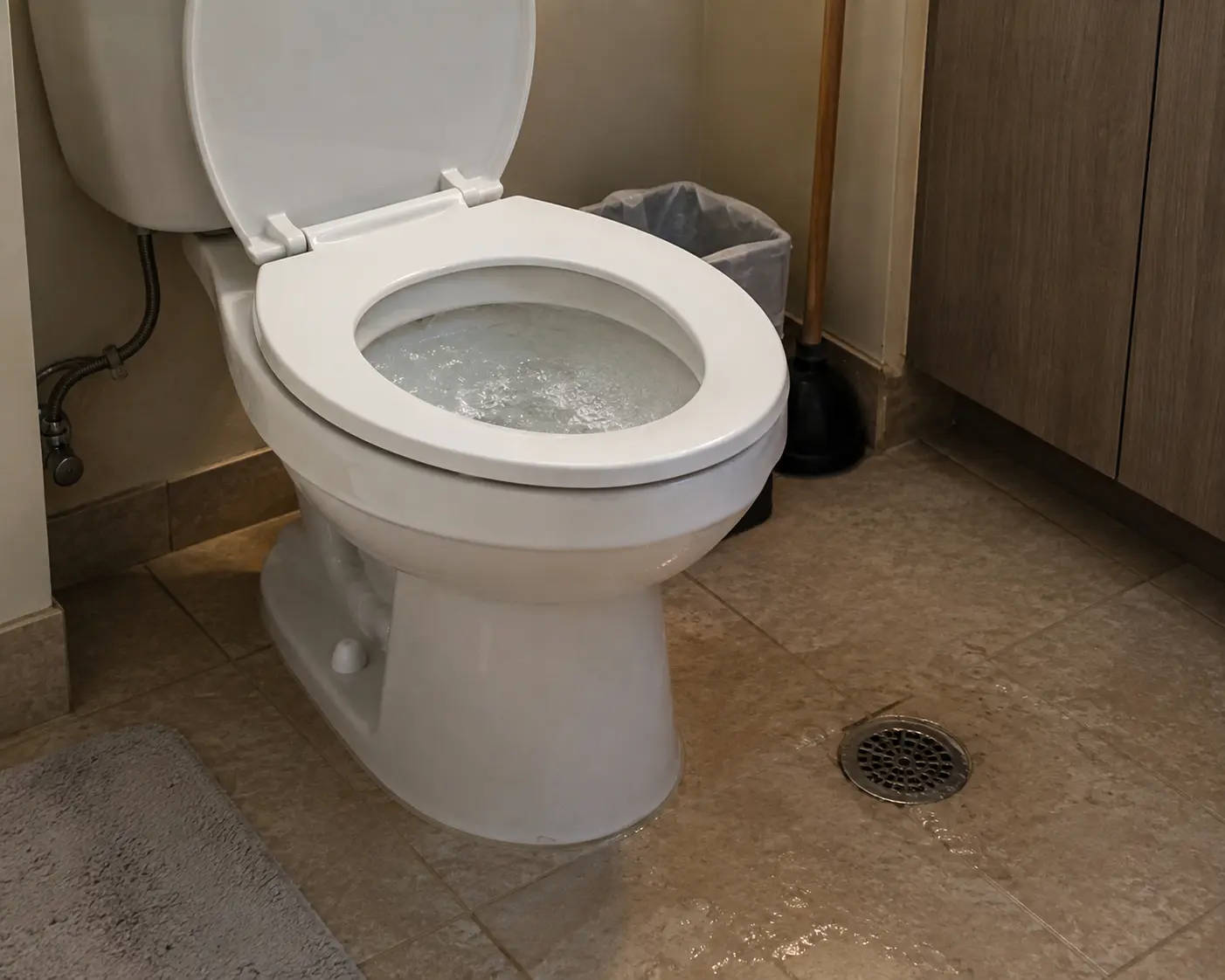 Drain inspection tools beside a toilet