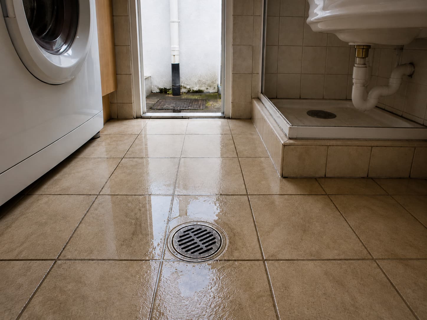 Drain inspection tools beside a bathroom floor waste